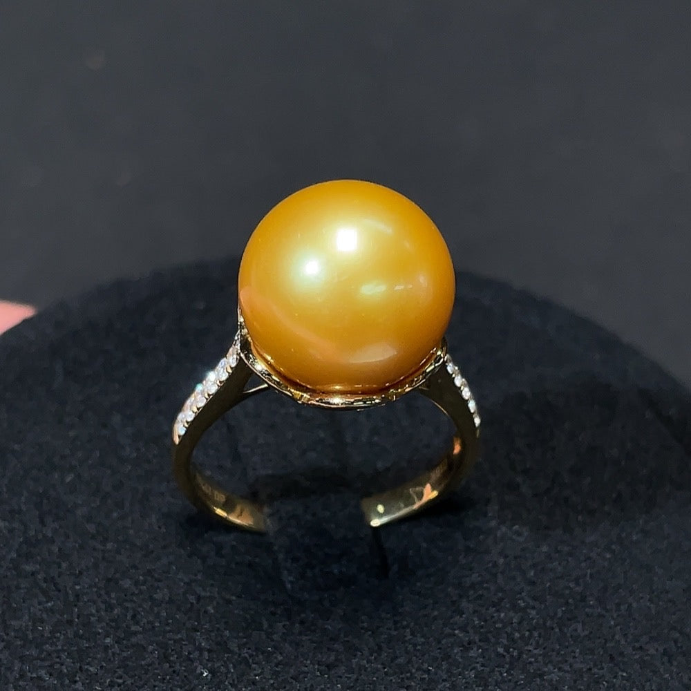 Saltwater pearl and diamond ring in 18K gold featuring a lustrous pearl and sparkling diamonds, designed by HKHQ.
