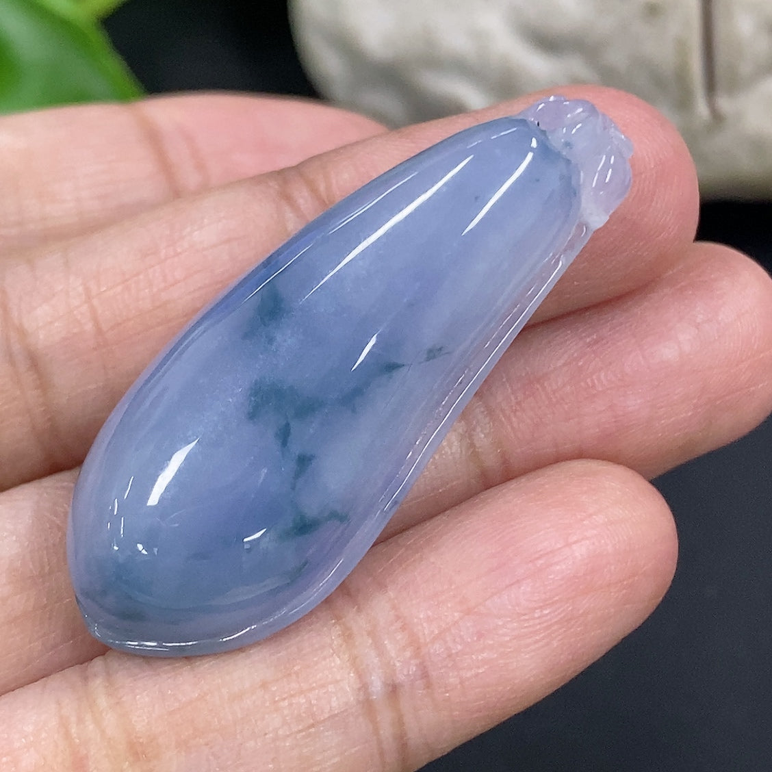 Jadeite auspicious gourd pendant with intricate carvings, weighing approximately 10.4g, displayed against a neutral background.