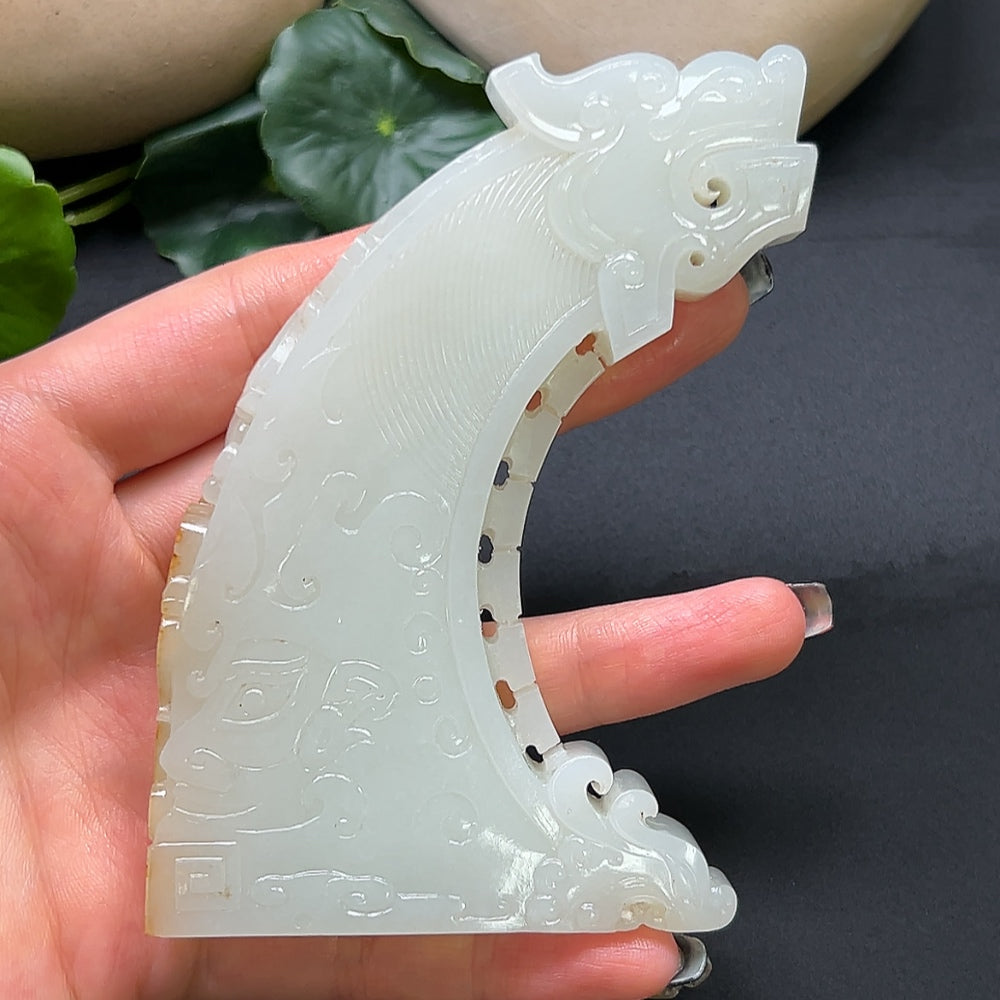 Hetian Jade Chinese Dream ornament featuring intricately carved jade in a traditional design, showcasing smooth, polished surface.