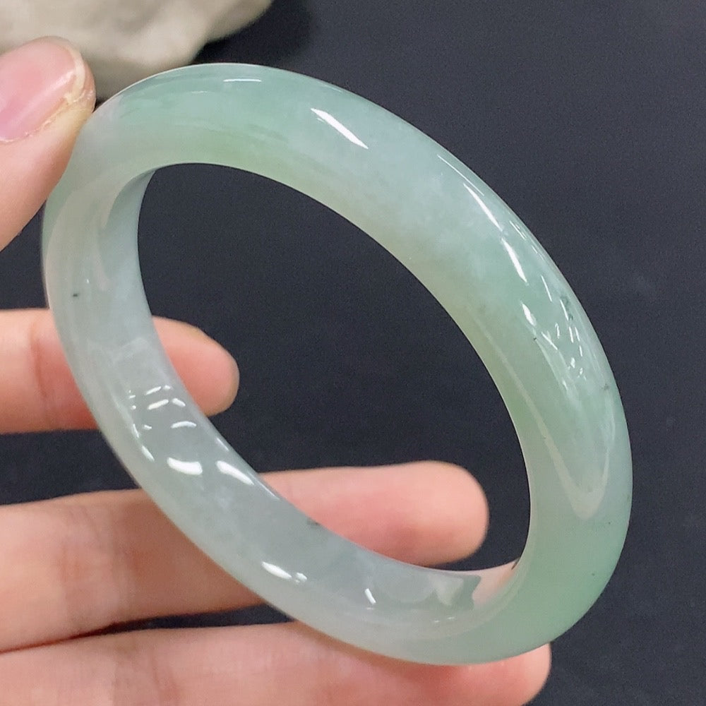 Jadeite round bracelet in size 55 with approximately 49.08g weight, featuring smooth jade beads on a durable string.