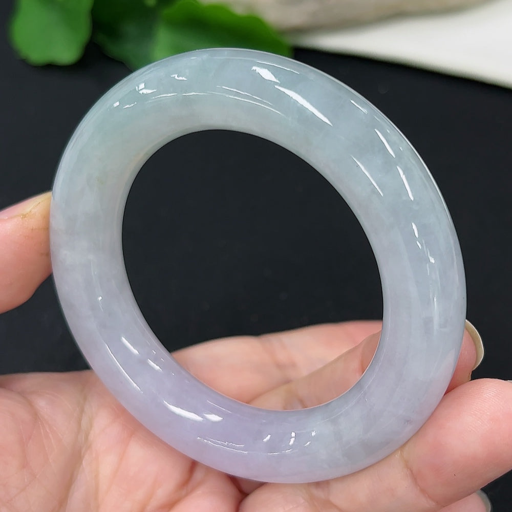 Jadeite round bangle in size 50, weighing approximately 78.1g, featuring smooth, polished jade with a glossy finish.