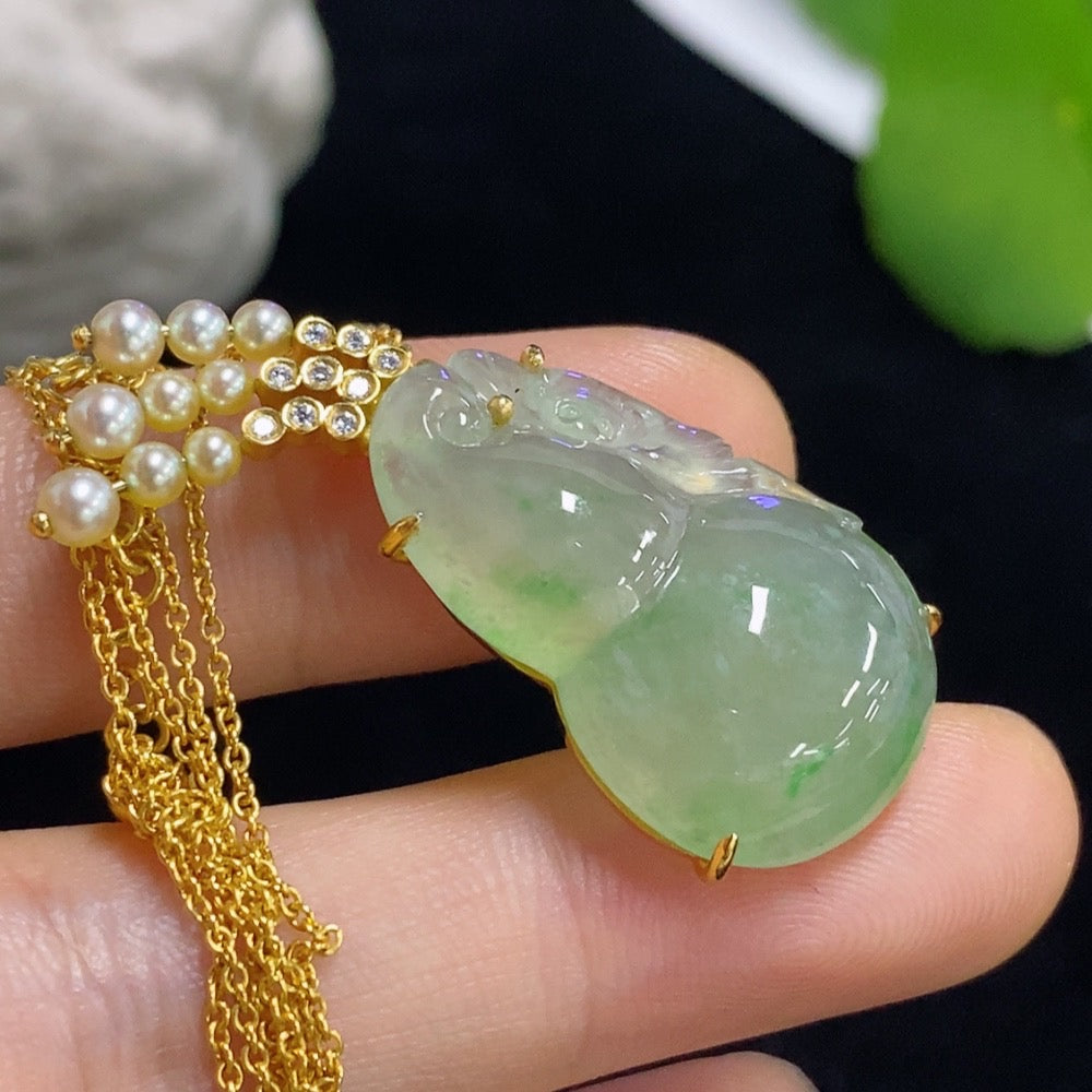 Jadeite gourd pendant set in 18k gold with diamond accents, total weight approximately 8.15g (including chain)