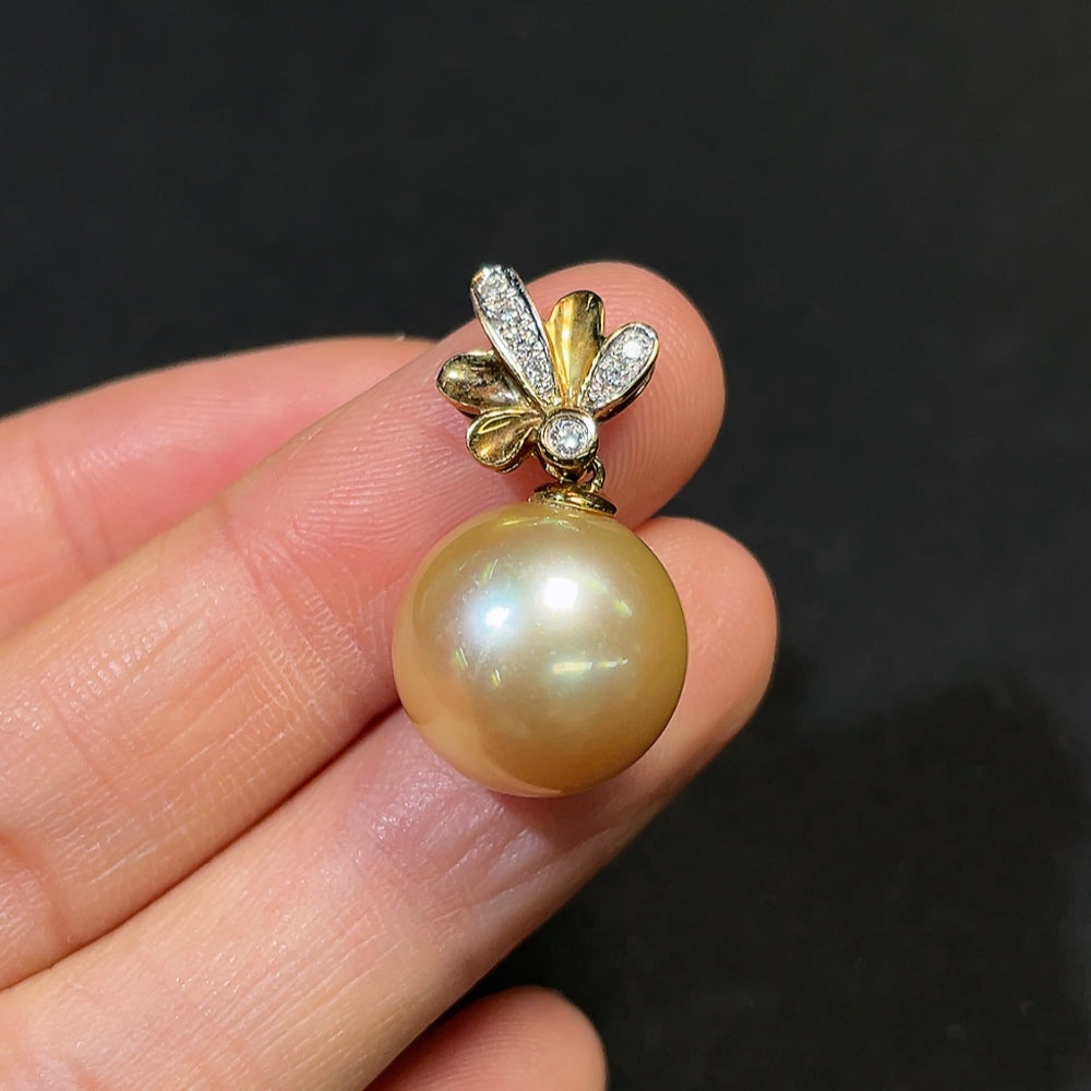 Seawater pearl pendant with 18K gold and diamond accents, approximately 13.8mm, from HKHQ, showing the pendant's elegant design.