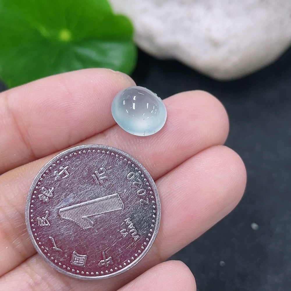 HKHQ jadeite cabochon jewelry, 0.71g, smooth polished green gemstone with natural luster and rounded shape.