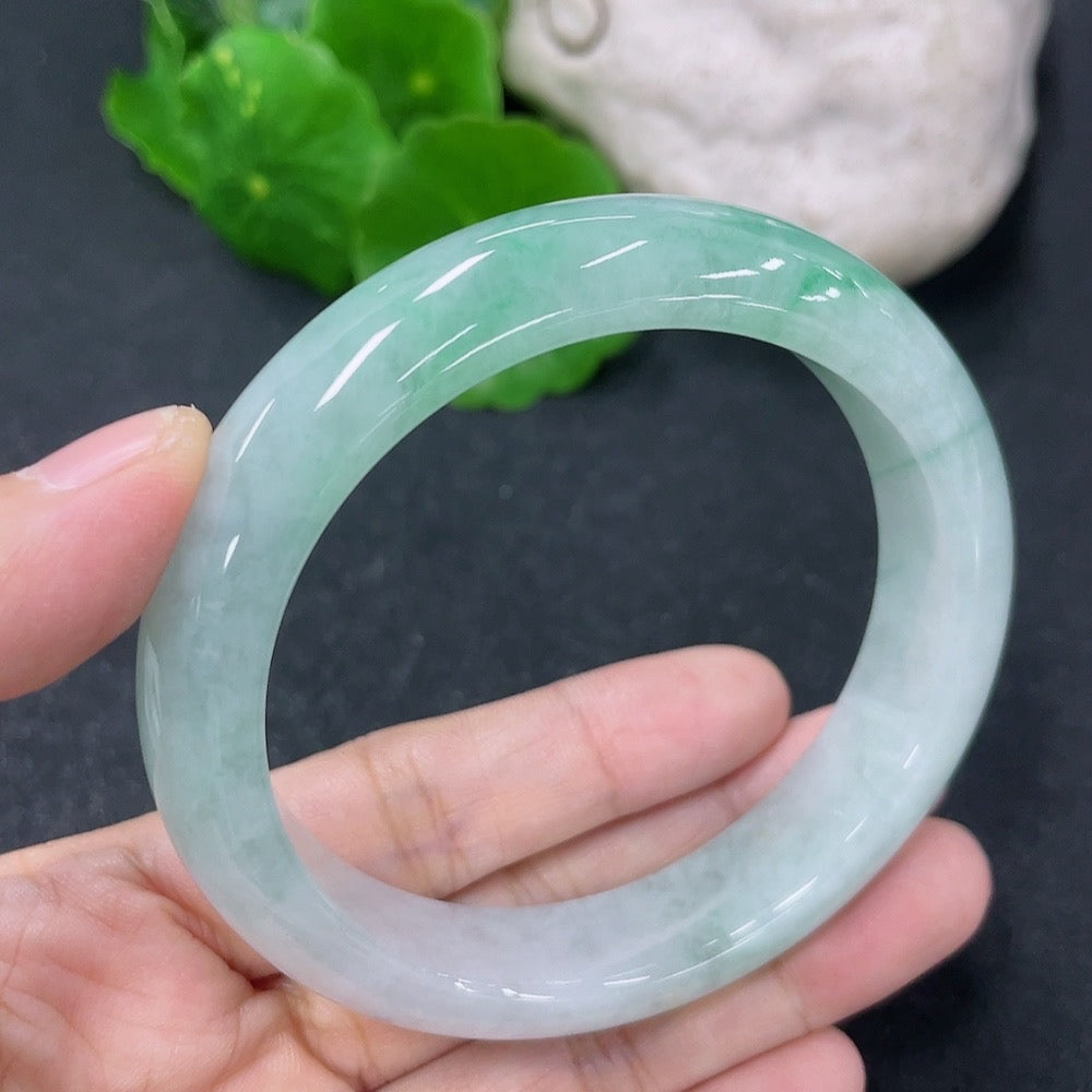 HKHQ jadeite round bracelet, 55.2mm diameter, weighing approximately 56.52g, showcasing smooth, polished green jade stones.