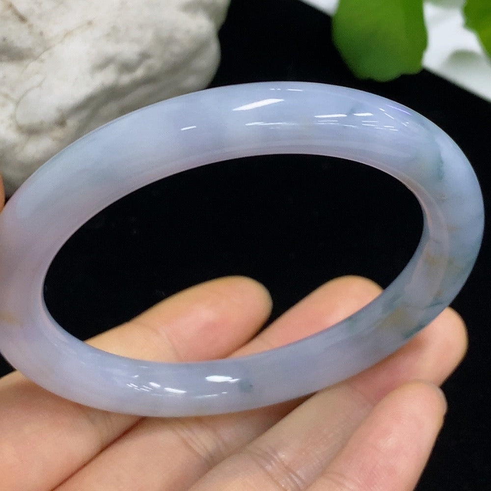 HKHQ jadeite round bangle, 40.06g, size 55.6, smooth polished jade jewelry with a glossy finish.