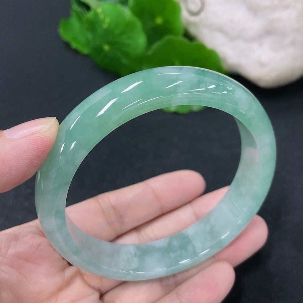 Jadeite round bangle in size 56.8mm with a 50.5g weight, featuring smooth polished jadeite surface and HKHQ branding.