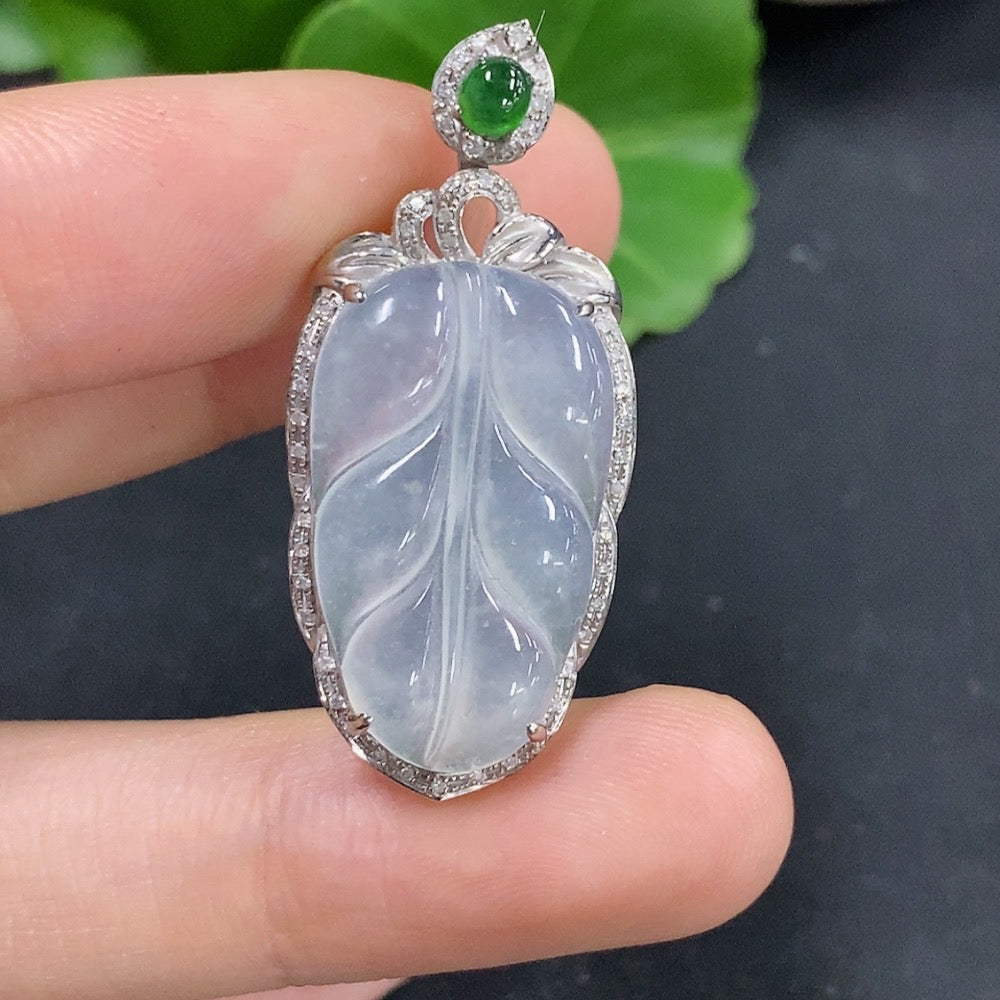 Jadeite leaf inlaid pendant with 18K gold and diamond accents, crafted by HKHQ, weighing approximately 3.9 grams.