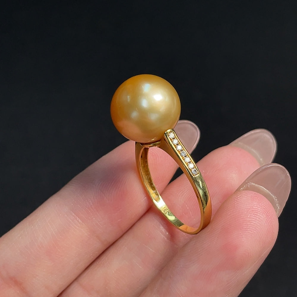 Seawater Pearl ring by HKHQ with 18K gold setting, diamond accents, size 17, and natural colored pearls.