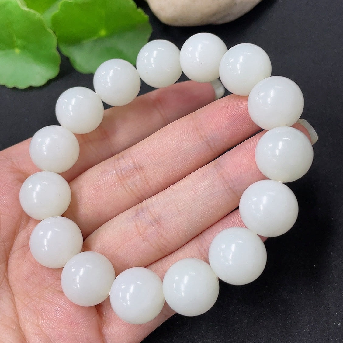 Hetian Jade bracelet with 13.6mm beads, weighing approximately 62g, crafted by HKHQ, displayed on a neutral background.
