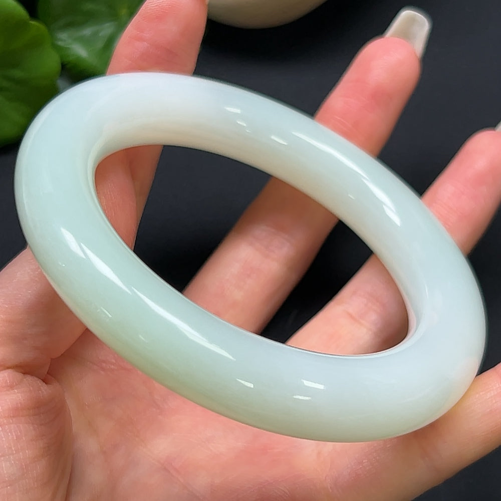 HKHQ Hetian Jade round bangle bracelet, size 61.5, weighing 96.73g, showcasing smooth, polished jade craftsmanship.