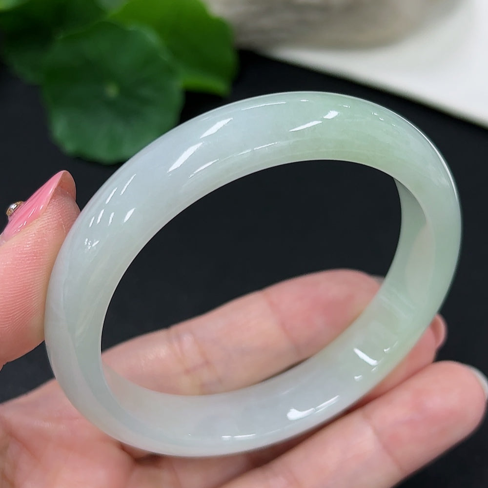 HKHQ jadeite round bangle in size 56, weighing 46.3g, featuring a smooth, polished jadeite bracelet on a neutral background.