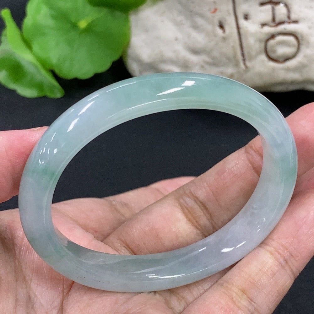 HKHQ Jadeite Concubine bracelet with green jade stones, size 53.4/44.6, weighing approximately 32.7g.