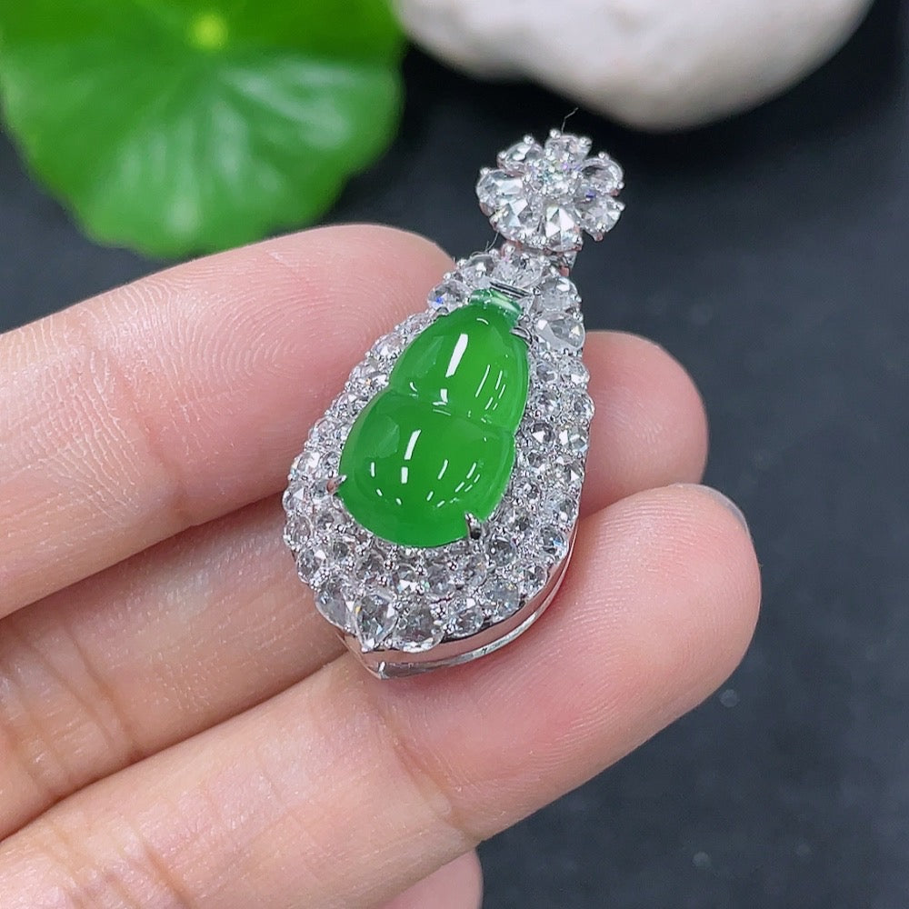 Jadeite inlaid gourd pendant with 18k gold and diamonds, HKHQ jade jewelry, detailed close-up of the pendant's intricate design.