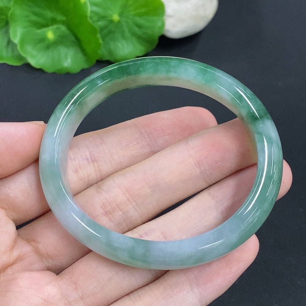 HKHQ Jadeite oval bangle in size 53, weighing 38.1g, featuring a smooth, polished jadeite bracelet with an oval shape.