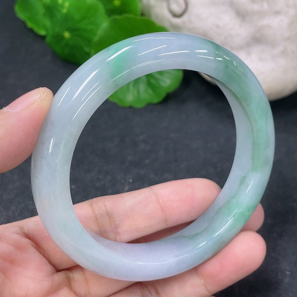 HKHQ jadeite round bracelet weighing 57.3g with a 54.3mm size, featuring smooth, polished green jade beads.