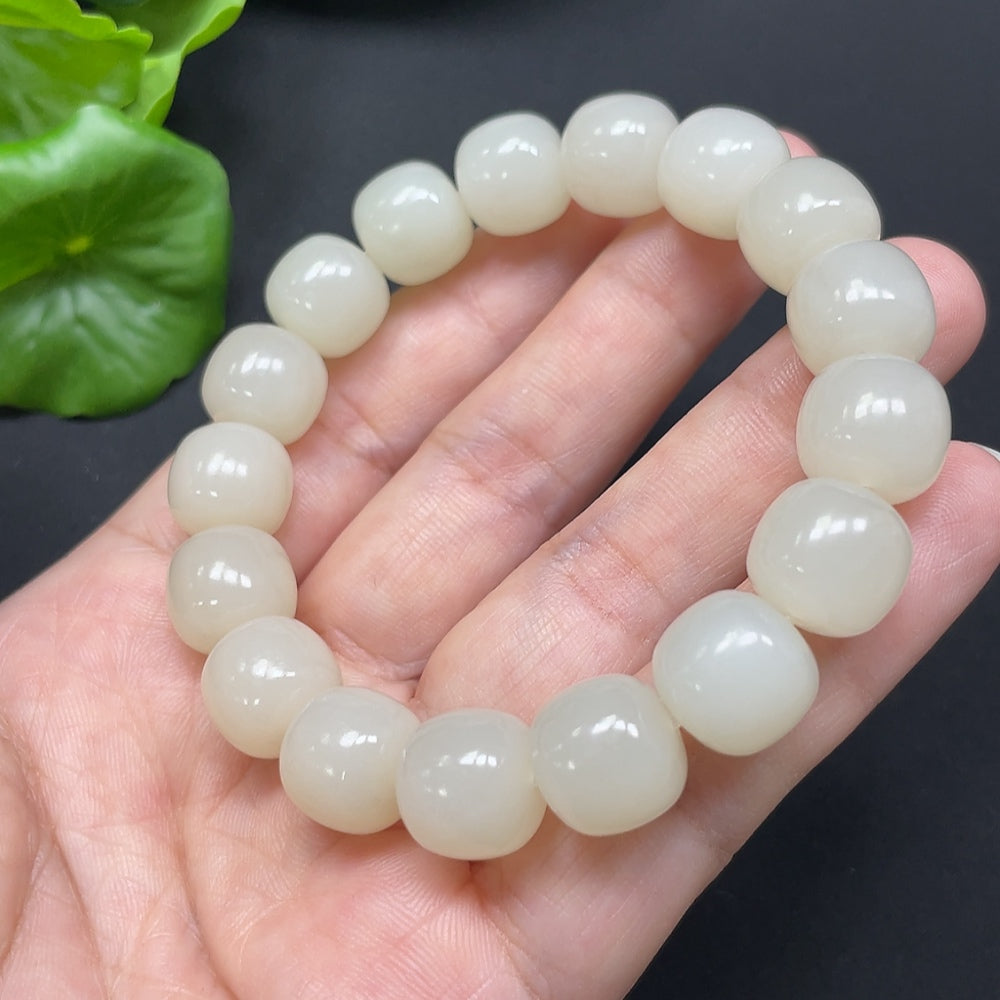HKHQ Hetian Jade bracelet with 12mm beads, approximately 49.78g, showcasing smooth, polished jade stones on a string.