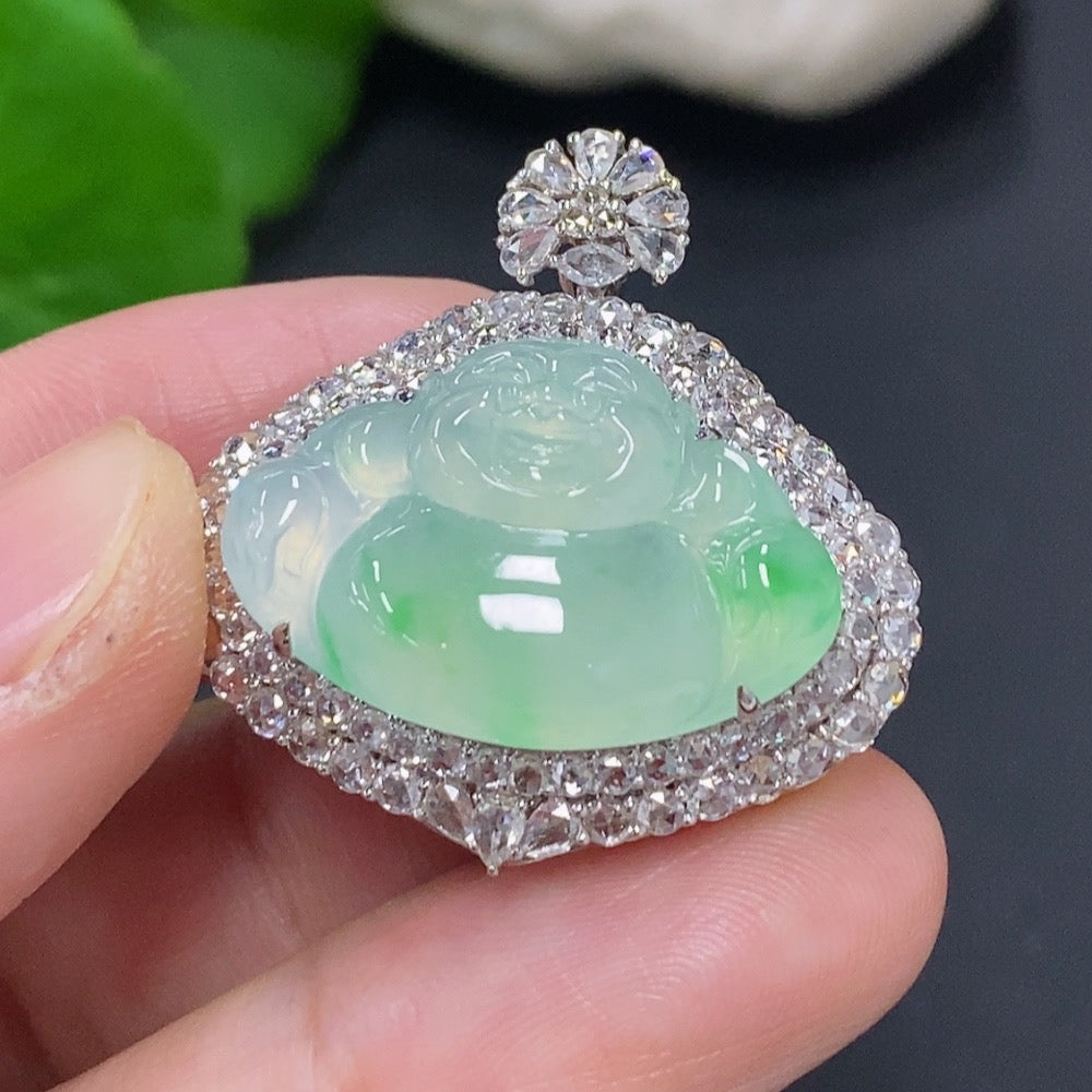 Jadeite Buddha pendant with 18K gold setting, accented with diamonds, showcasing detailed jade carving and a polished gold frame.