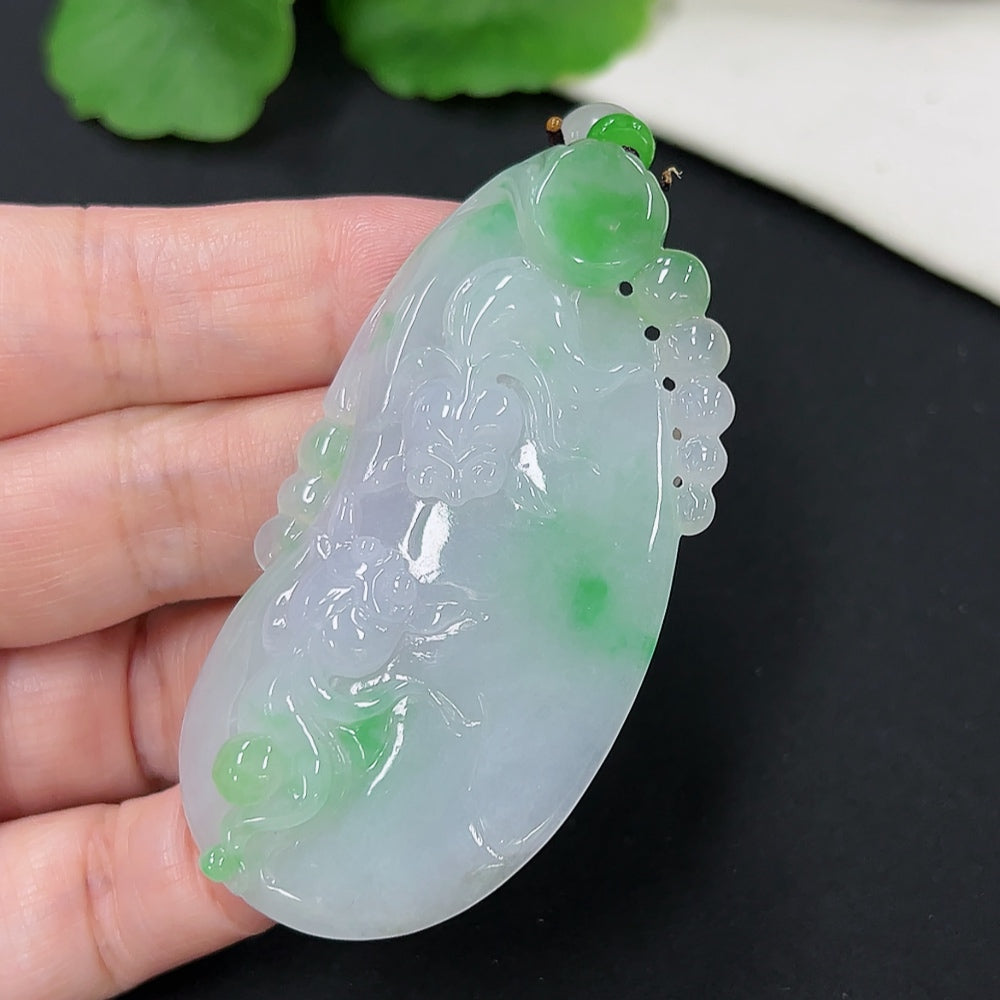 Jadeite goldfish pendant with gold accents, weighing approximately 30.5g, featuring intricate details and a decorative rope.