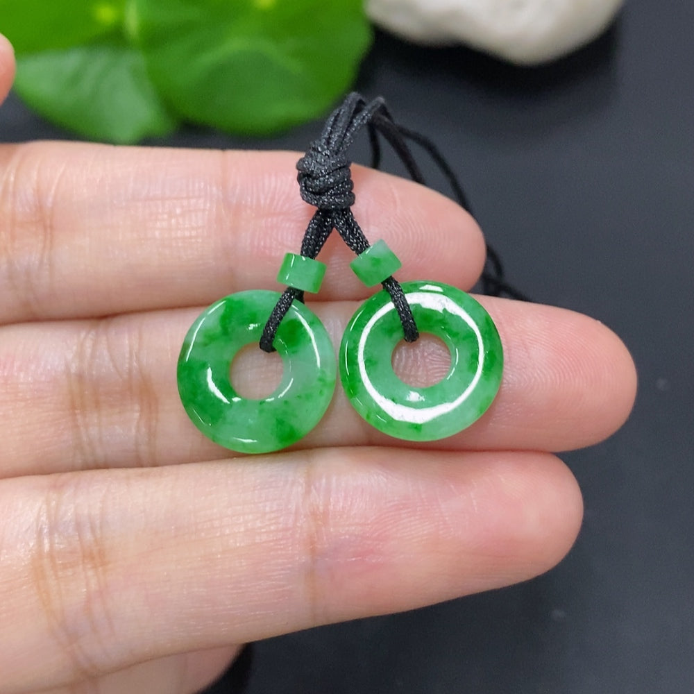 Set of jadeite donut pendants for necklaces, approximately 2.3g total weight, featuring green jadeite stones on a neutral background.