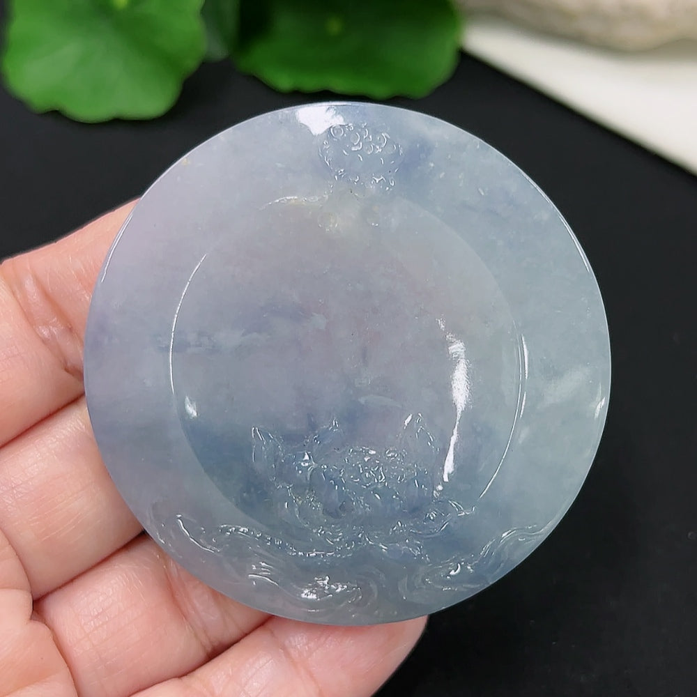 Jadeite lotus pendant from HKHQ with intricate carved design, weighs approximately 39.4g, displayed on a neutral background.