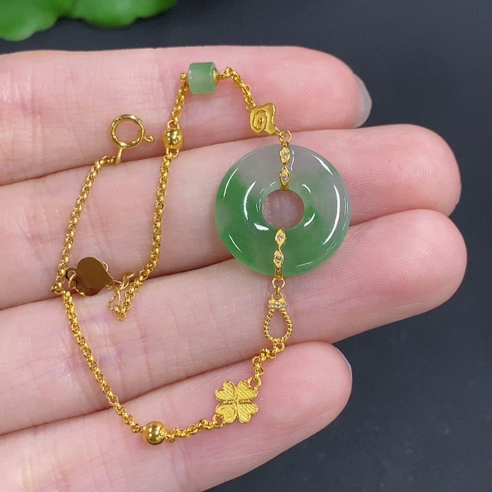 Jadeite donut inlay bracelet by HKHQ featuring 18k gold and diamond accents, showcasing a delicate jade jewelry design.