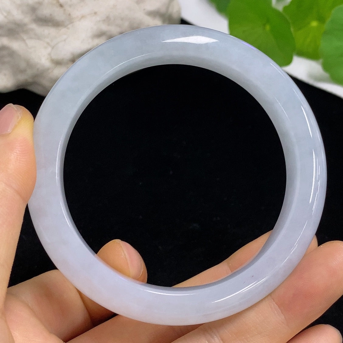 Jadeite round bangle from HKHQ, size 58.8 with a total weight of approx. 64.88g, showcasing smooth, polished jade surface.