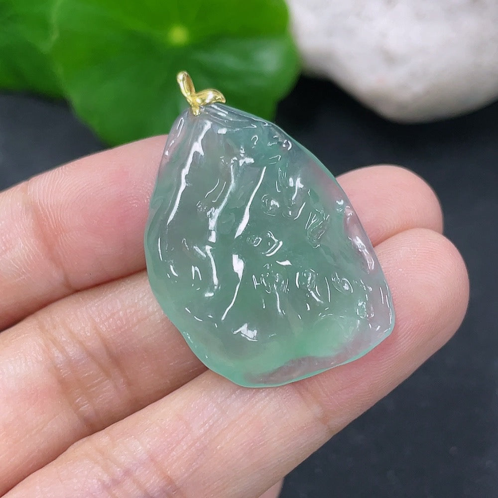 Elegant jadeite pendant with 18k gold setting, weighing approximately 6.34 grams, featuring a smooth, polished jade stone.