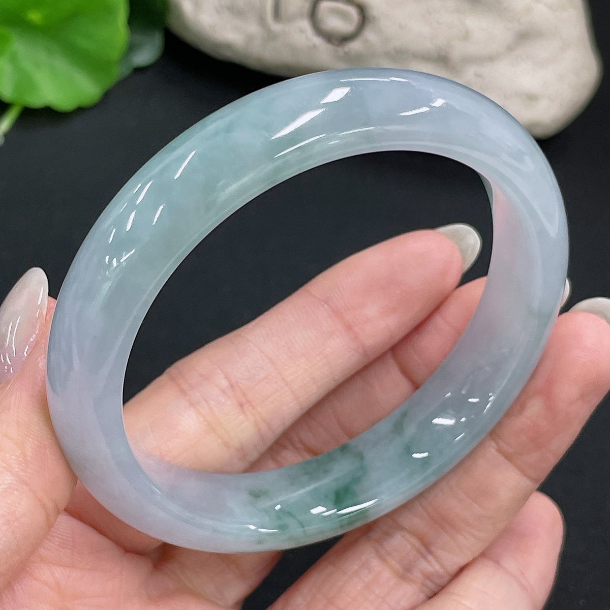 HKHQ jadeite round bangle, 54.6g, size 56.3, showcasing smooth, polished jade jewelry with a glossy finish.