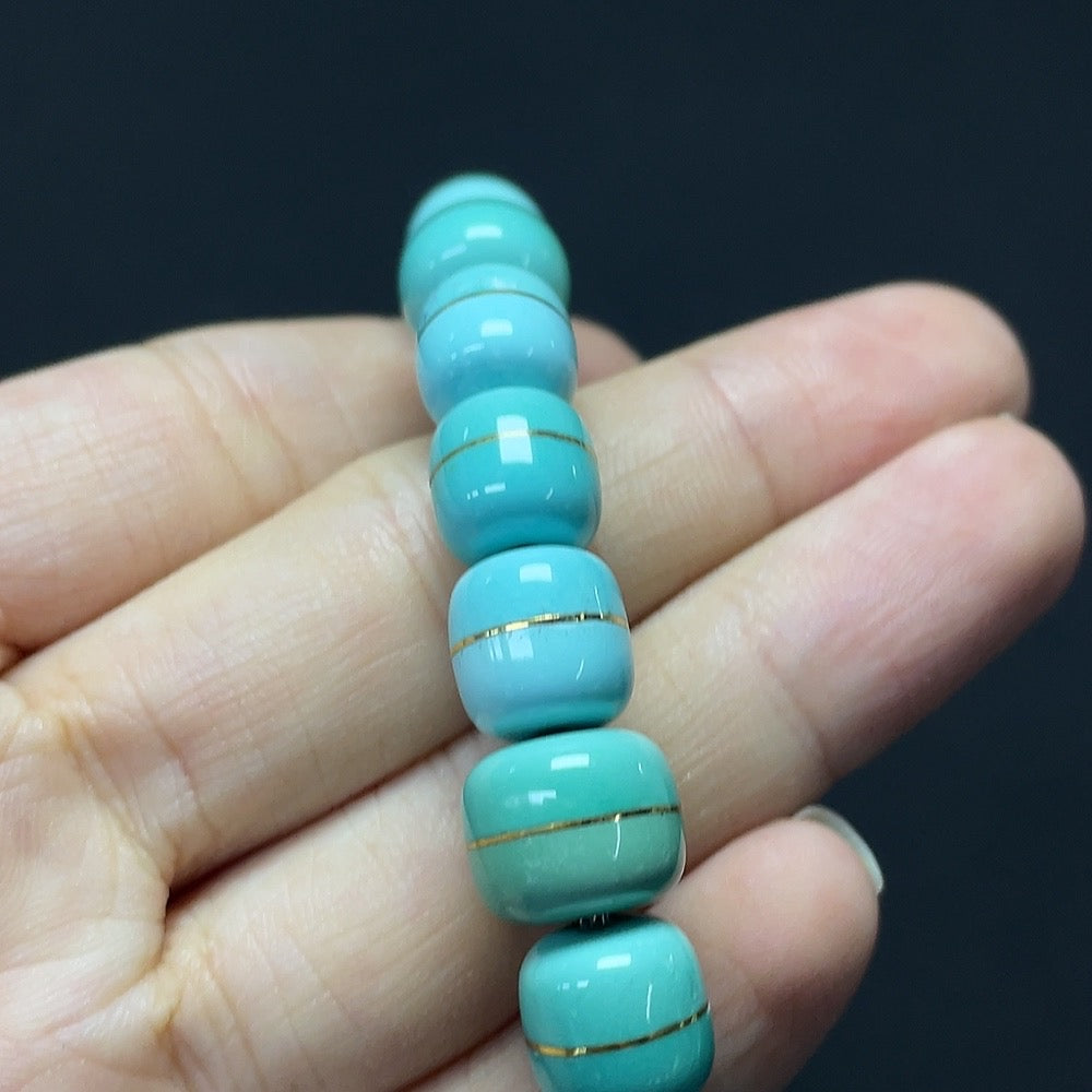 Turquoise gemstone bracelet with 37% gold content and stone inclusions, featuring large 8.9-10.7mm beads, HKHQ brand jewelry