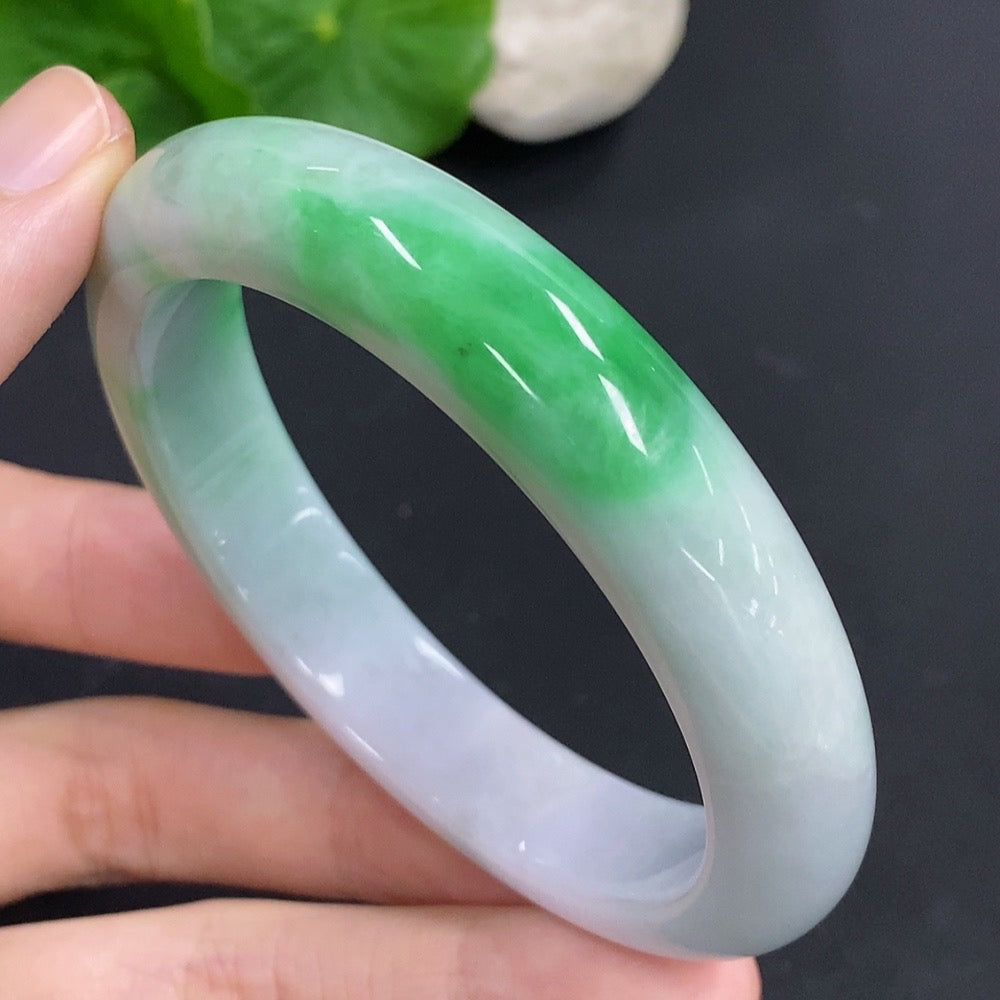 HKHQ jadeite round bangle, 60.6g, size 57.3, showcasing smooth, polished jadeite with a glossy finish.