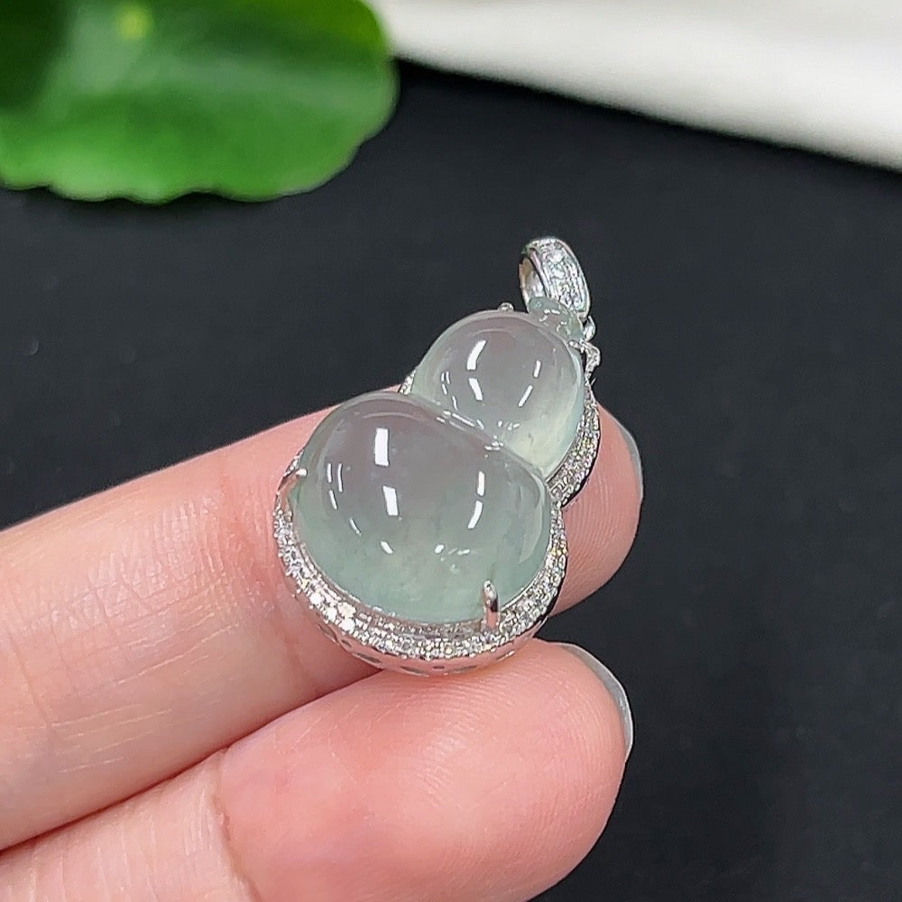 Jadeite gourd pendant with diamond accents on a necklace, 9k gold, crafted by HKHQ, weighing approximately 4.78 grams.