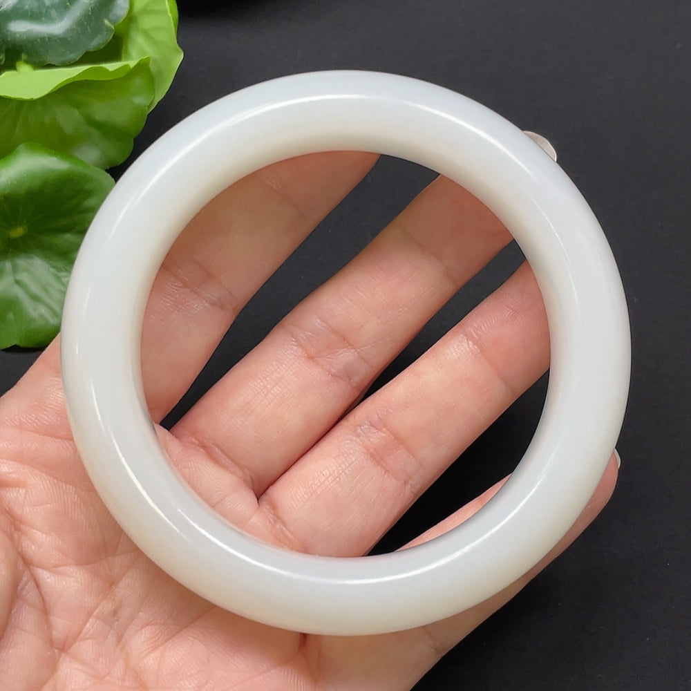 HKHQ Hetian Jade round bangle bracelet, size 60.8, weighing 104.26g, showcasing smooth, polished green jade craftsmanship.