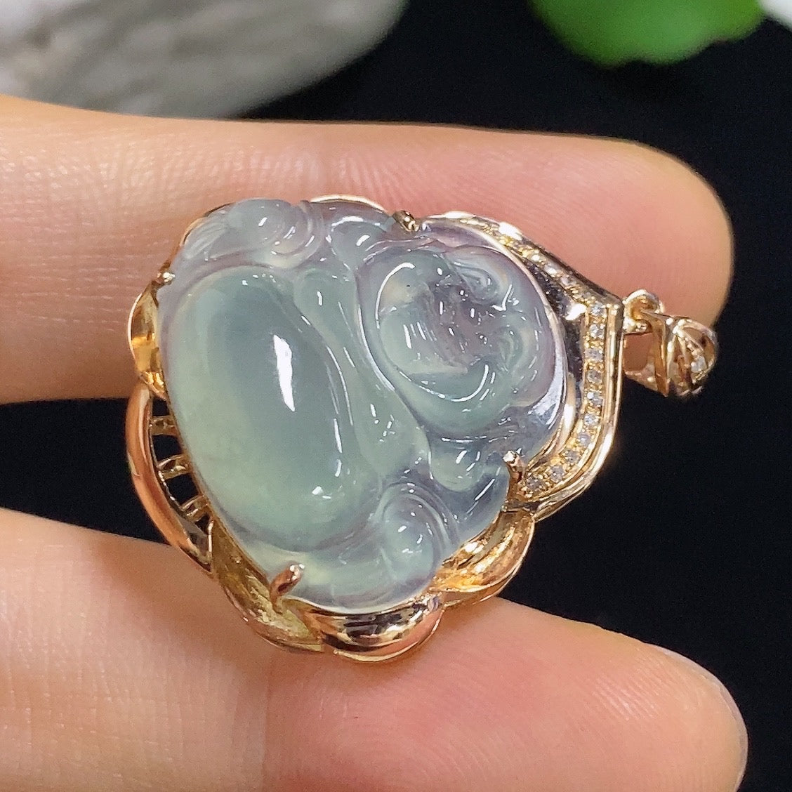 Jadeite Buddha pendant with 18k gold accents and diamond details, weighing approximately 5.65g, showcasing intricate craftsmanship.
