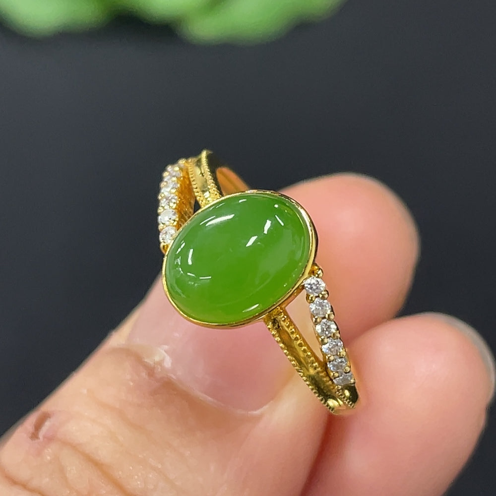 HKHQ Hetian Jade Jasper cabochon ring with 18K gold band, accented with diamonds, size 15, weighing approx. 2.6g.