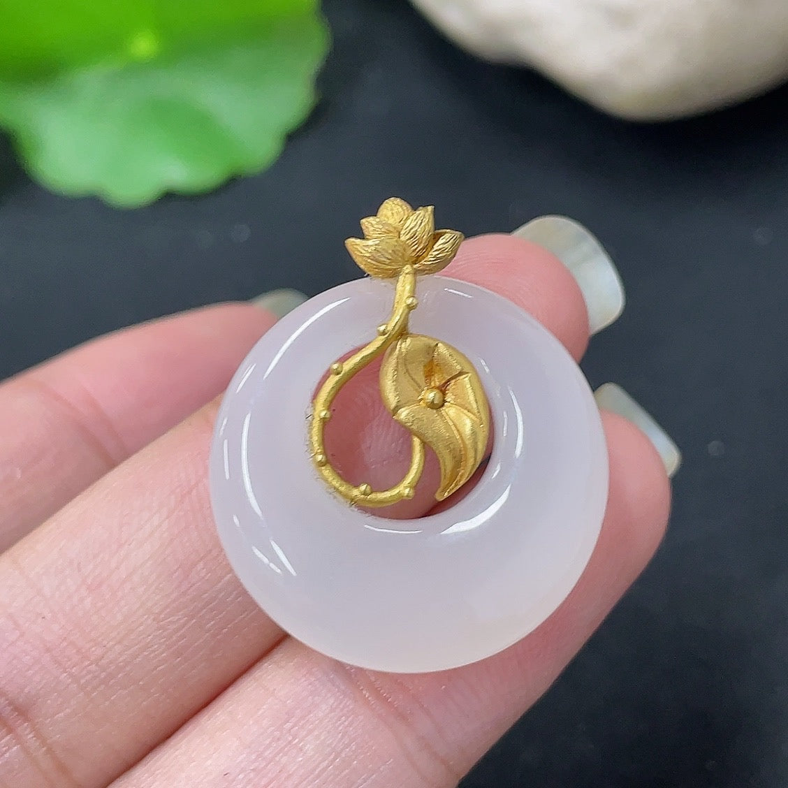 Hetian Jade inlaid pendant necklace with 18K gold setting, crafted by HKHQ, showcasing a detailed jade design on a delicate chain