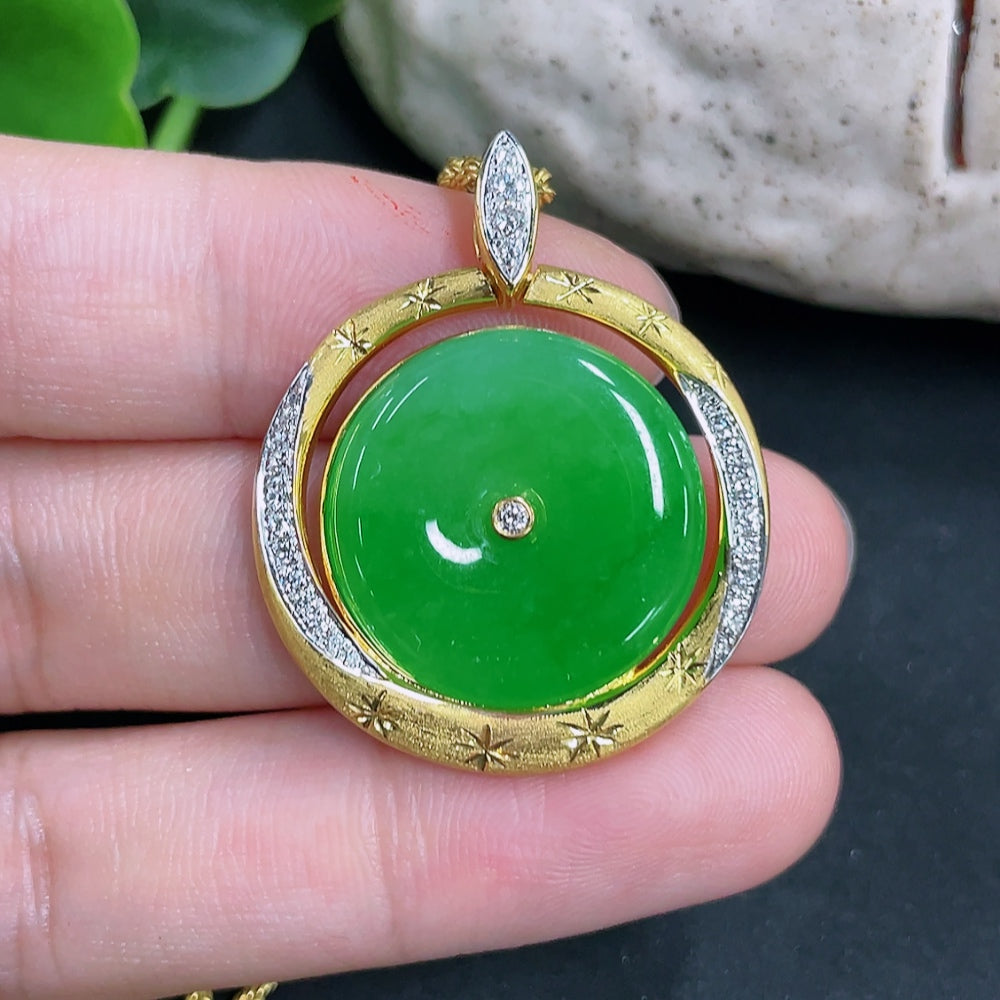 Jadeite pendant with 18k non-diamond setting and chain, weighing approximately 12.5 grams, featuring a polished jade gemstone.