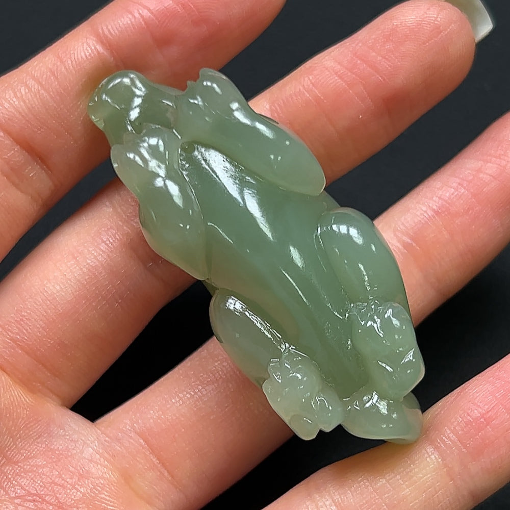 Hetian jade Pi Xiu pendant from HKHQ, intricately carved jade jewelry weighing approximately 40g, showcasing traditional craftsmanship.