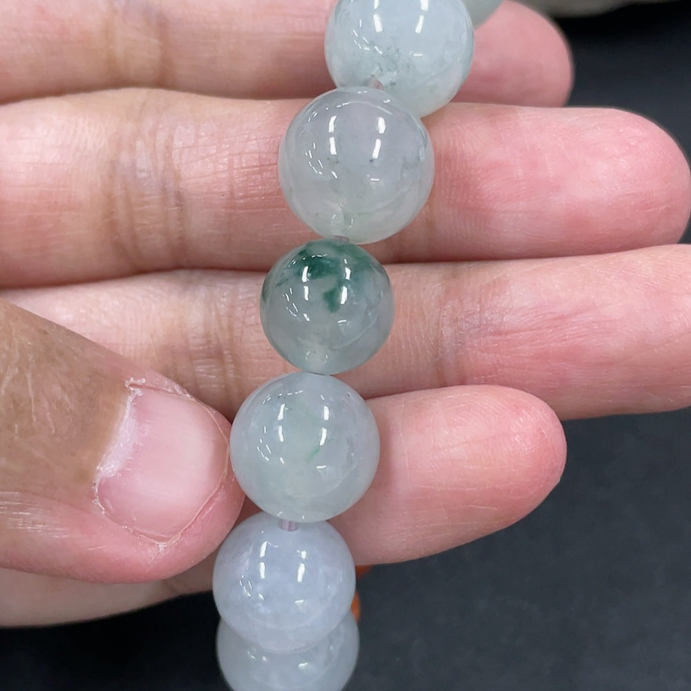 Jadeite and wood bead bracelet with 12.2mm beads, handcrafted by HKHQ, showing jade and wood beads strung together.