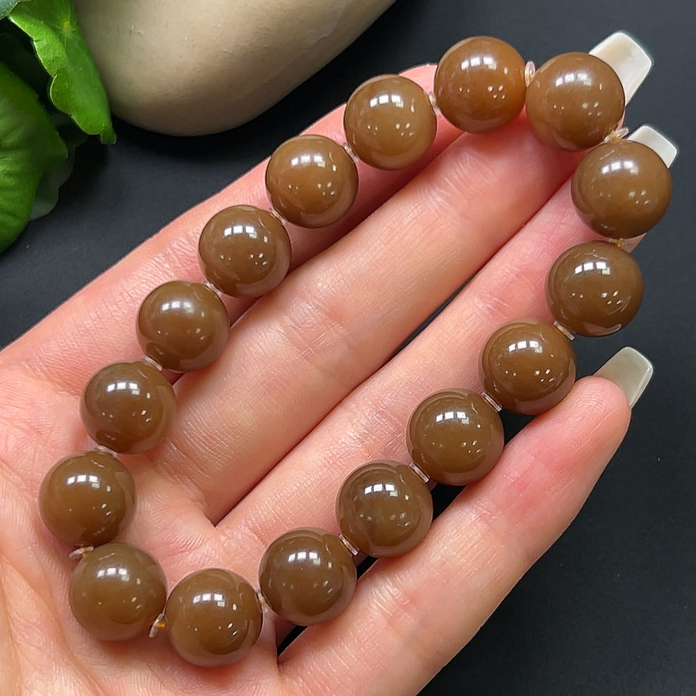 Hetian Jade bracelet with 12.1mm beads, crafted from high-quality jade, weighing approximately 43.69 grams.