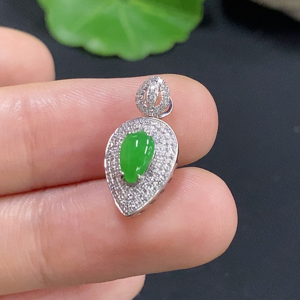 Jadeite inlaid pendant on 18k gold necklace with diamond accents, featuring intricate craftsmanship and a polished finish.