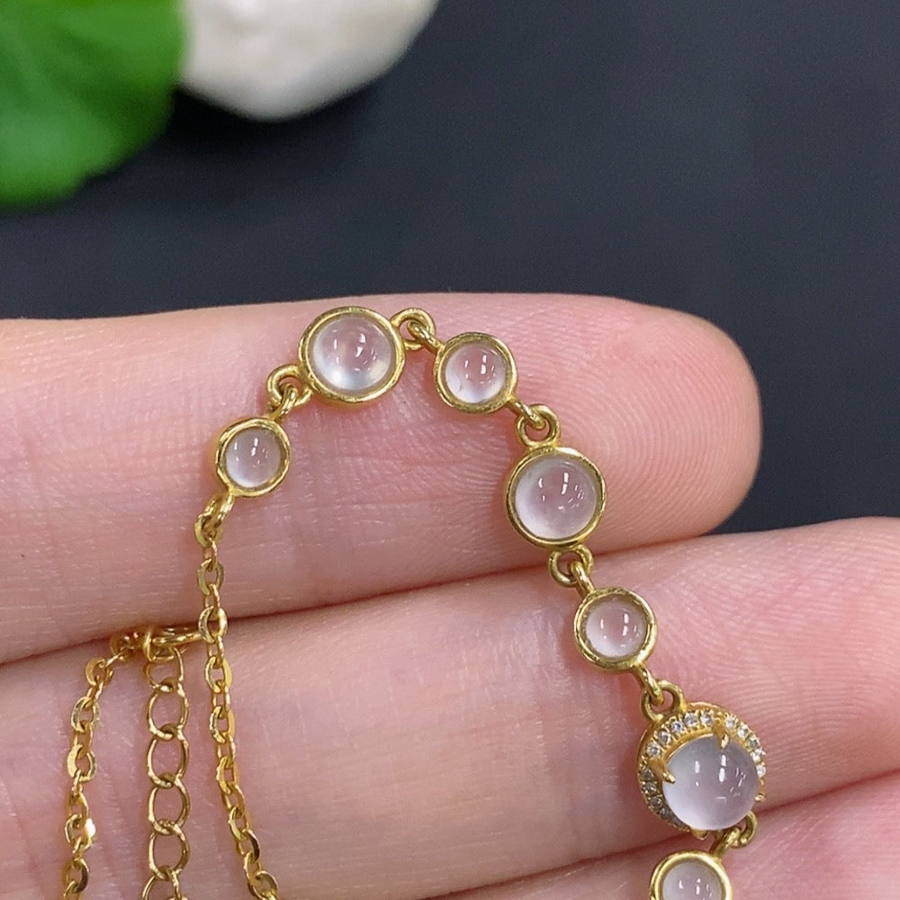 HKHQ jadeite cabochon inlay bracelet with 18k gold and diamond accents, showcasing elegant gemstone setting.