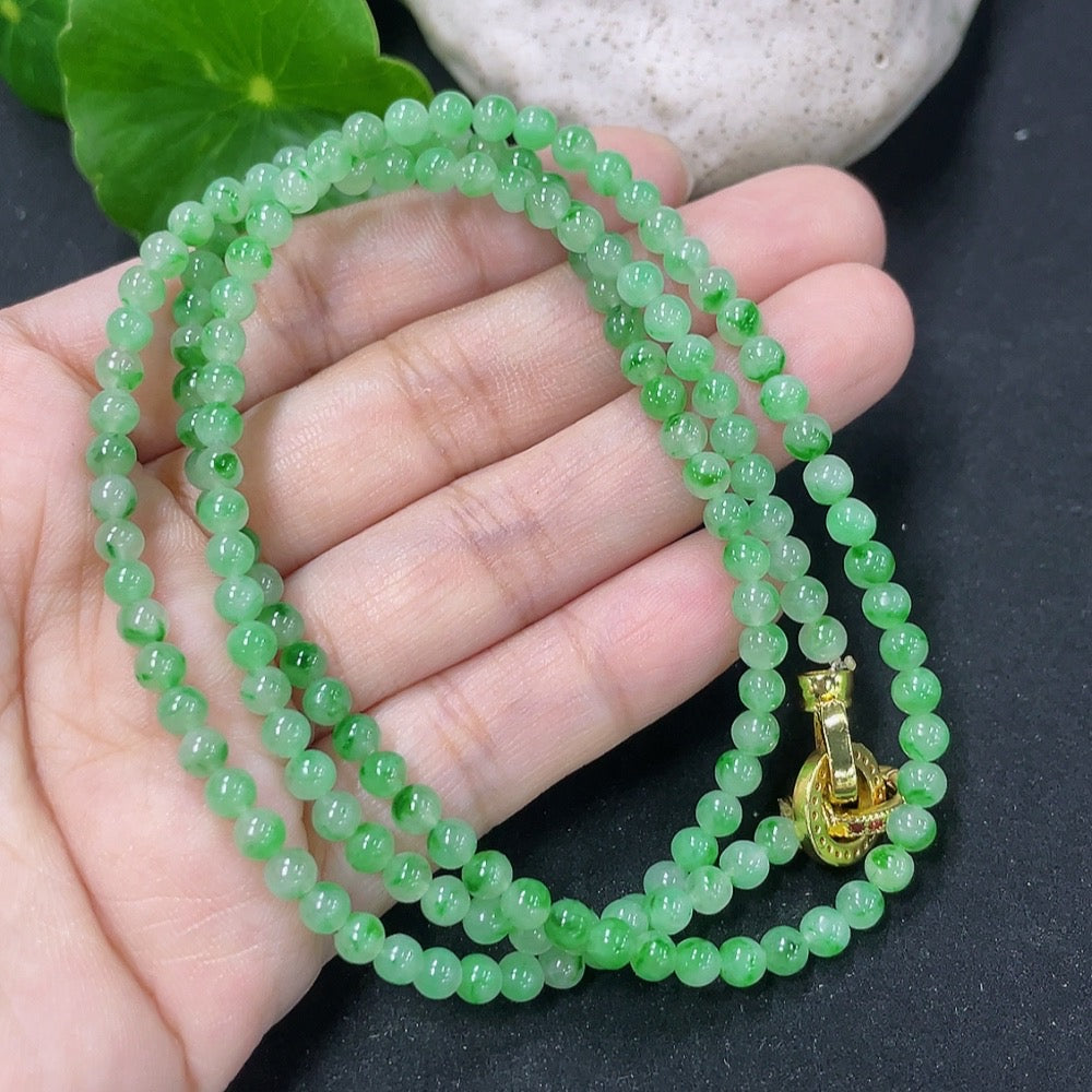 Jadeite bead necklace with 3.8mm jade beads from HKHQ, showing a close-up of the jade beads and mineral components on a neutral background.
