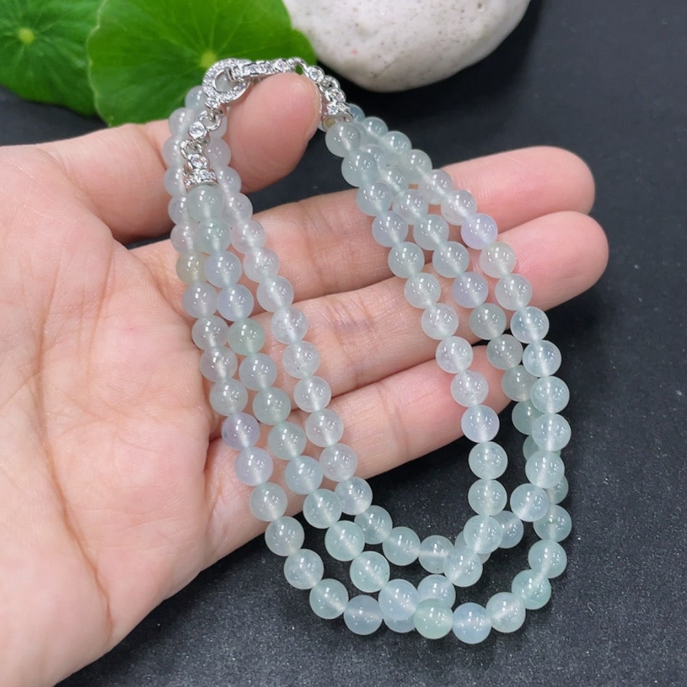 Jadeite beaded necklace with 5mm jade beads, non-gold, from HKHQ, weighing approximately 25.5 grams, shown on a plain background.