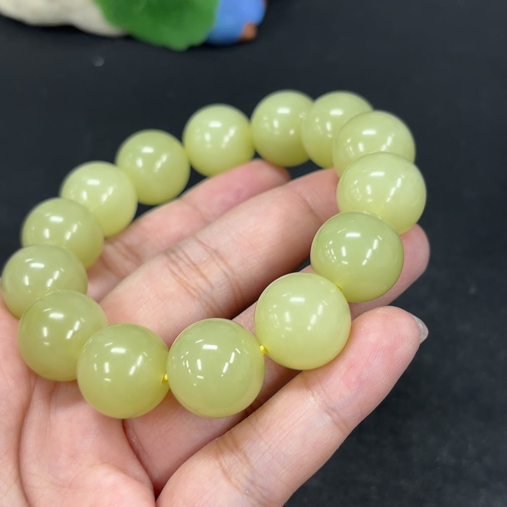 Hetian Jade bracelet with 15.9mm beads, weighing approximately 91.4g, featuring smooth, polished jade stones from HKHQ.