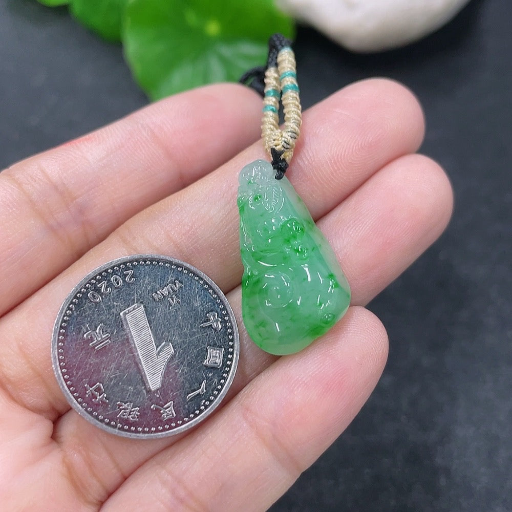 Jadeite pendant with Ruyi design from HKHQ, weighs about 4.45g, including the rope, showcasing smooth green jade craftsmanship.