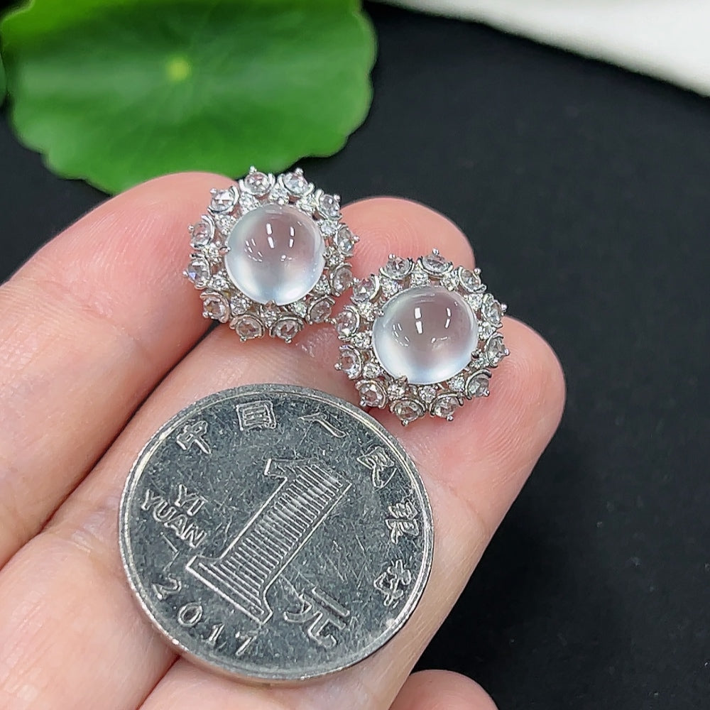 Unmarked jadeite earrings with gold and diamond accents, crafted in 18k gold, weighing approximately 4.9 grams.