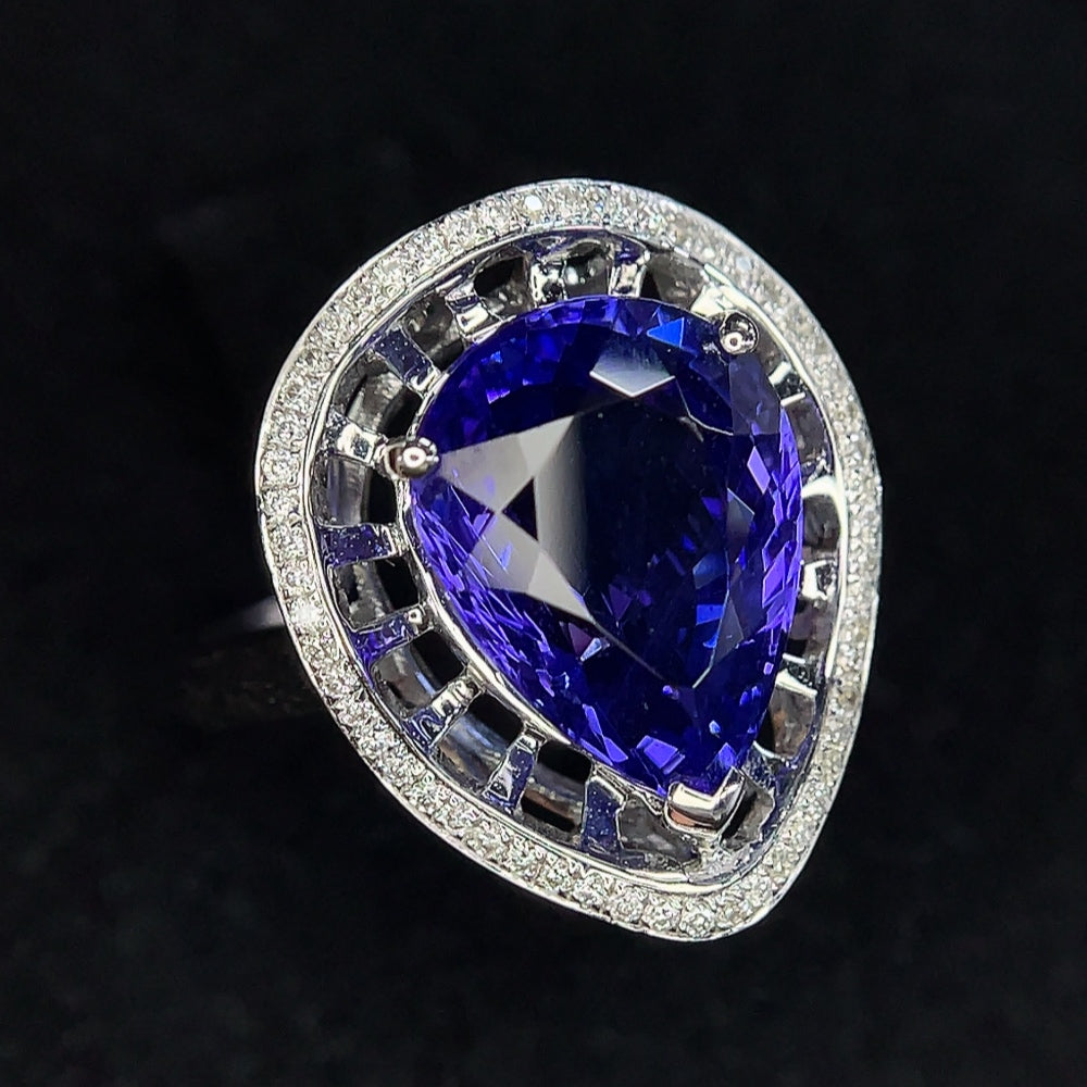 18K gold tanzanite ring with diamond accents, size 11, featuring vibrant gemstones and elegant design by HKHQ.