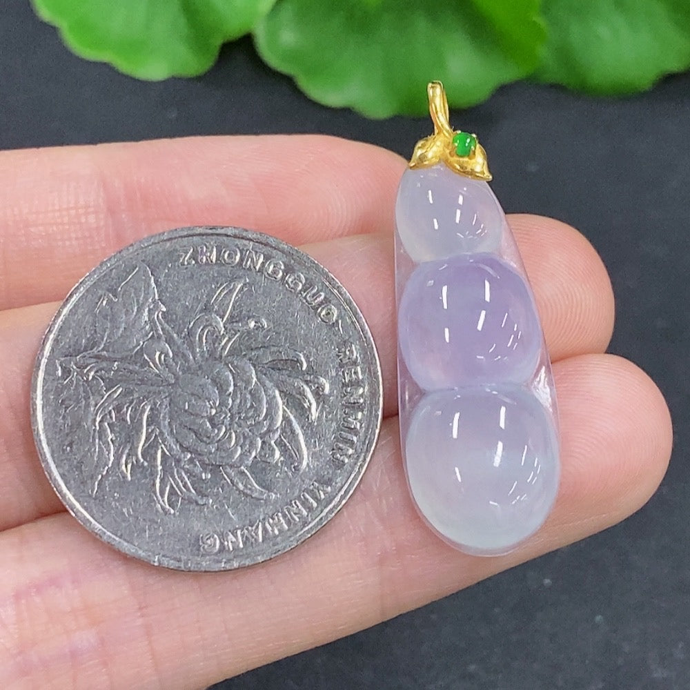 Jadeite lucky bean pendant with 18k gold clasp, showcasing a smooth green jade stone on a delicate chain.