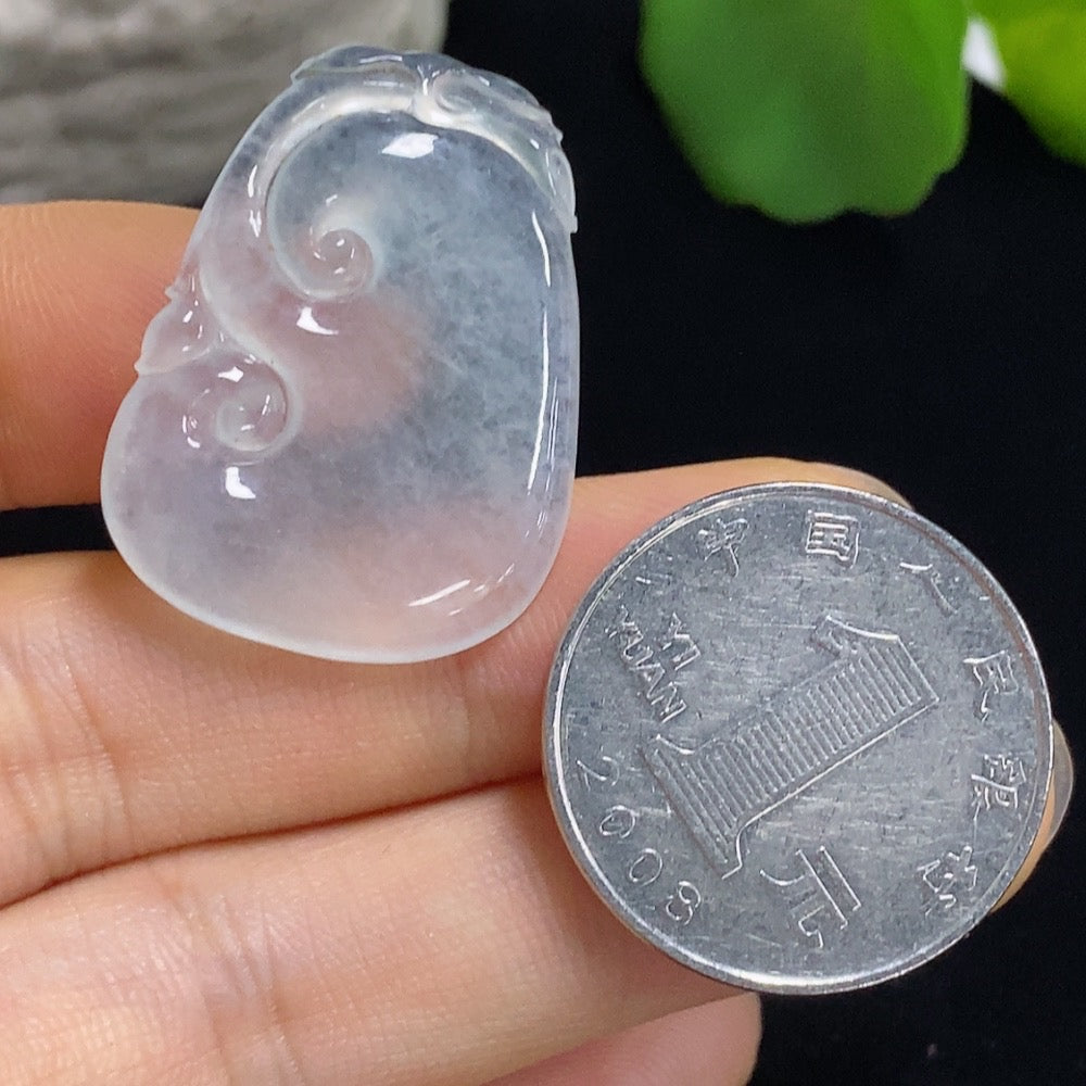 Jadeite Ruyi carving jewelry by HKHQ with inlaid setting, showcasing detailed craftsmanship and vibrant green jadeite.